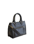 Black leather handbag with a crossbody strap on a white background