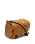 Brown leather bag with black strap on a white background