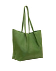 Green leather tote bag on a white background