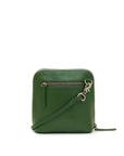 Green leather crossbody bag on a white background