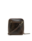 Brown leather crossbody bag with visible brand name on a white background