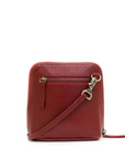 Red leather crossbody bag with gold zipper on a white background