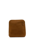 A brown suede pouch with rounded corners and a small leather tab detail on the top right, shown against a plain white background.