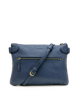 Blue handbag with a strap on a white background