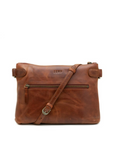 Brown leather handbag with a strap on a white background