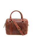 Brown leather duffel bag with a shoulder strap on a white background