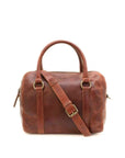Brown leather duffel bag with a shoulder strap on a white background