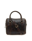 Brown leather bag with a strap on a white background