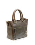 Brown leather handbag with a visible brand logo on a white background