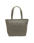 Green woven handbag on a white background