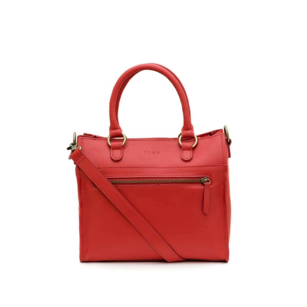 Red handbag with a shoulder strap on a white background