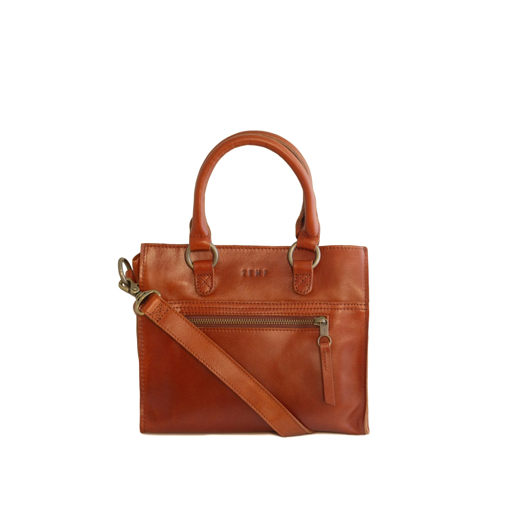 Chestnut leather handbag with a crossbody strap on a white background