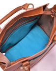 Brown leather handbag with blue interior on a white background
