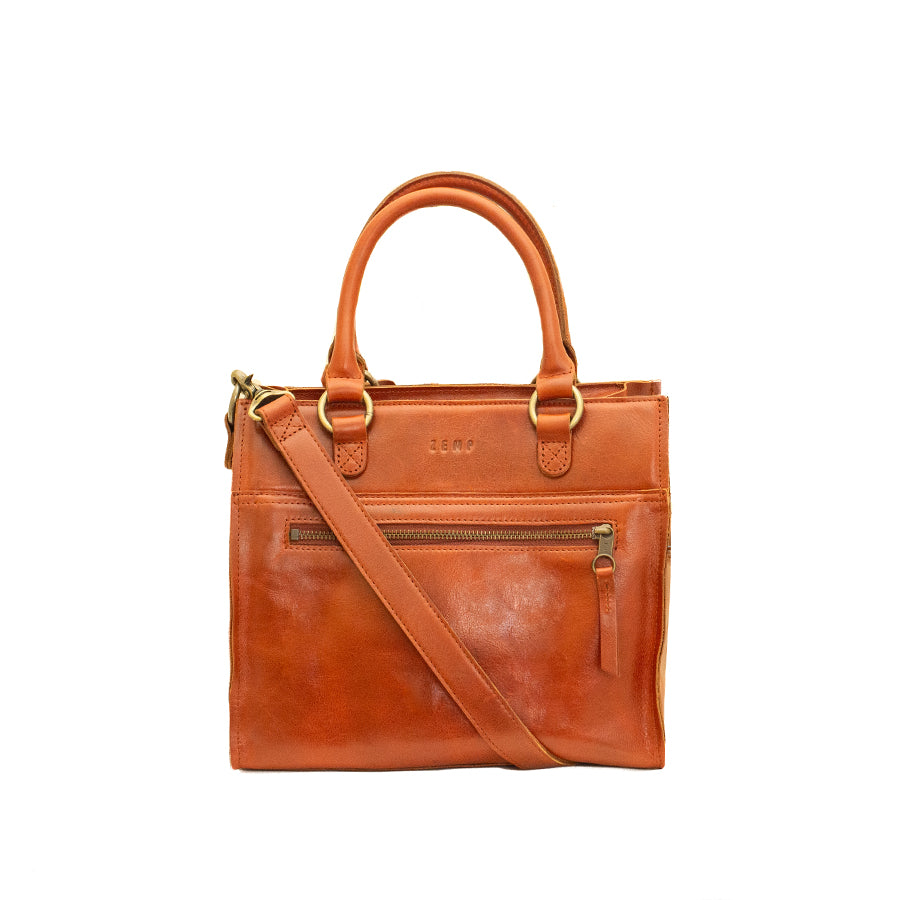 Brown leather handbag with a shoulder strap on a white background
