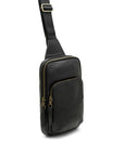 Black leather crossbody bag with gold zippers on a white background