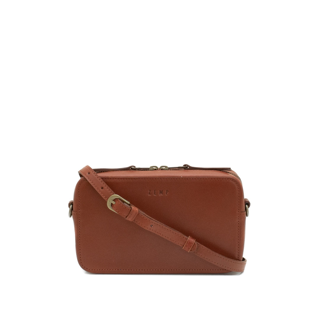 Brown leather crossbody bag on a white background