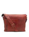 Brown leather shoulder bag on a white background