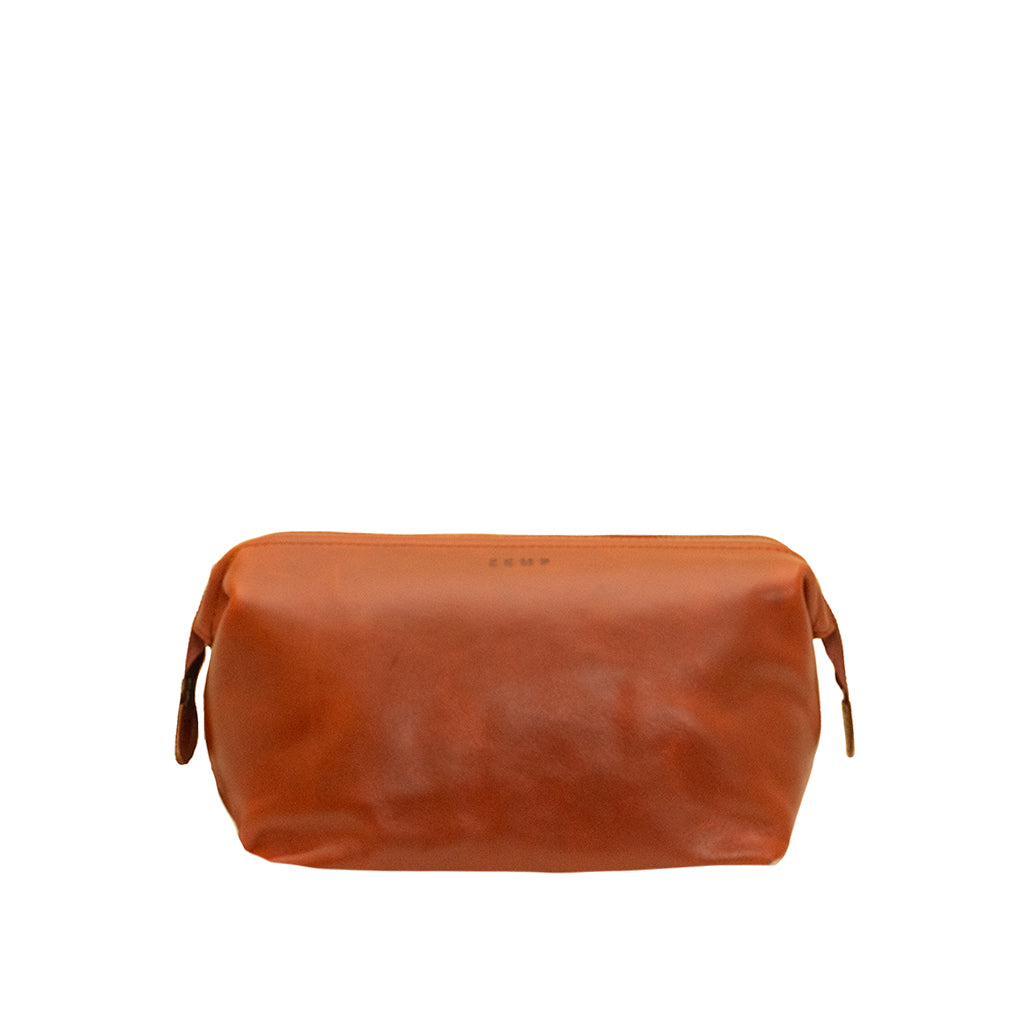 Brown leather toiletry bag on a white background