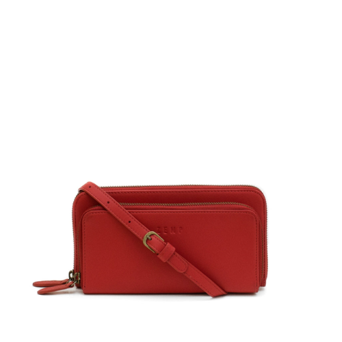 Red crossbody bag with a strap on a white background