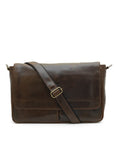 Brown leather messenger bag with a strap on a white background