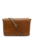 Brown leather messenger bag with a strap on a white background