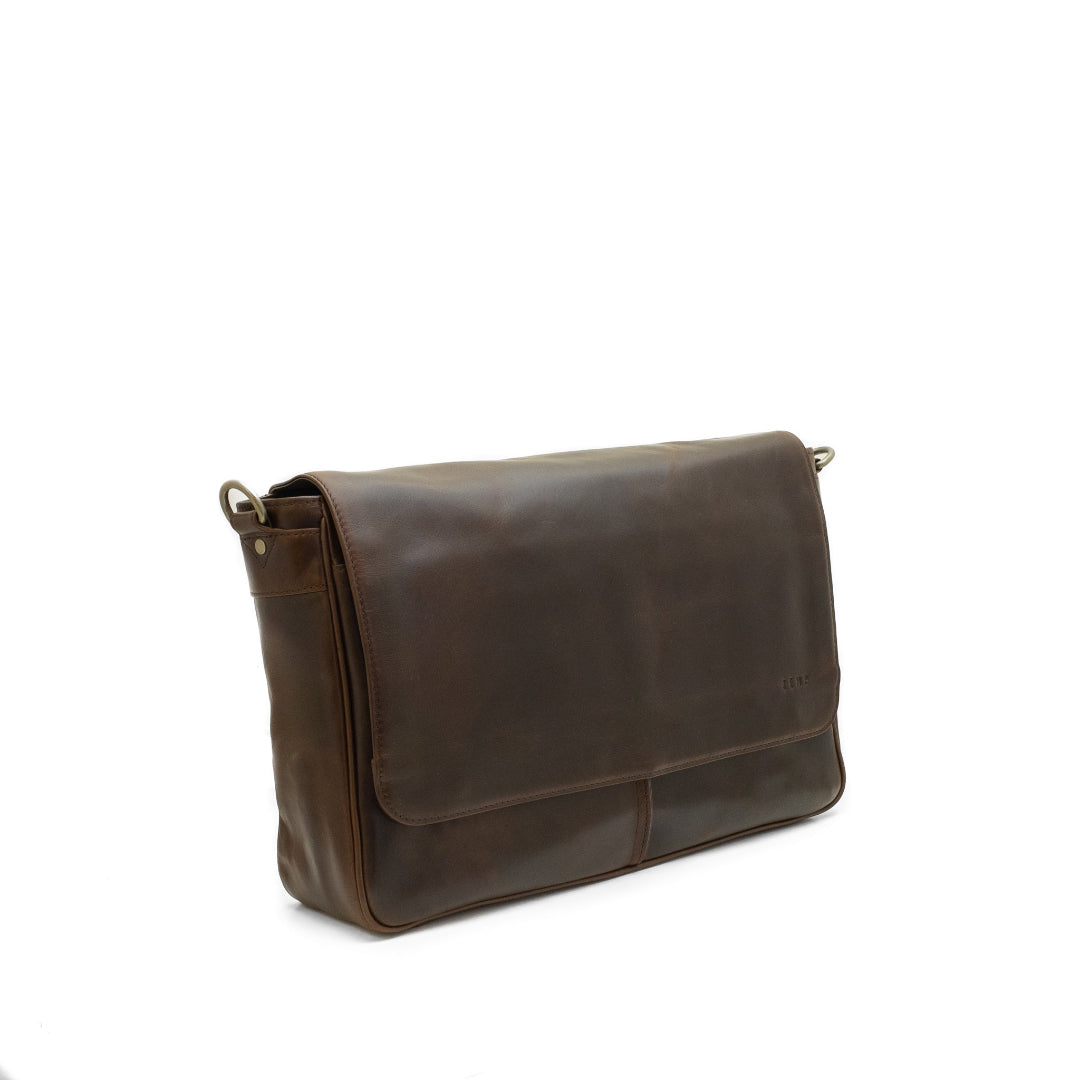 Brown leather messenger bag on a white background