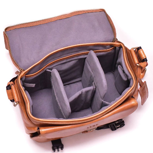 Brown leather bag with gray interior on a white background