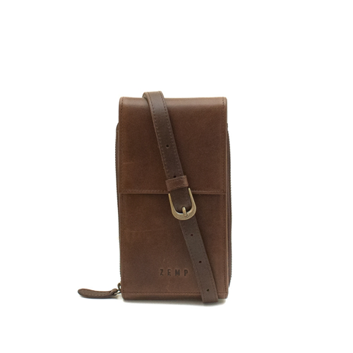 Brown leather phone case with strap on a white background