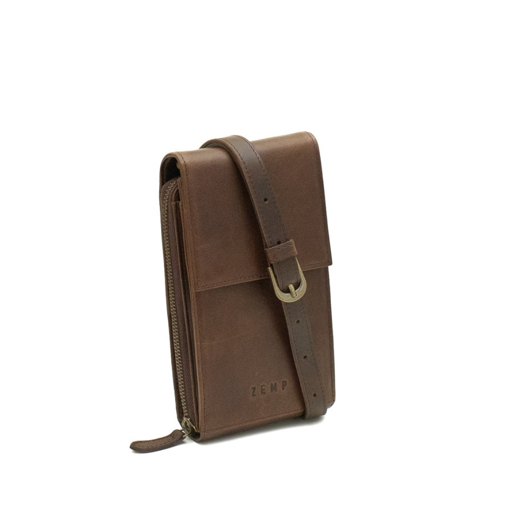 Brown leather pouch with strap on a white background