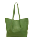 Green leather tote bag on a white background