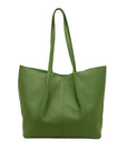 Green leather tote bag on a white background