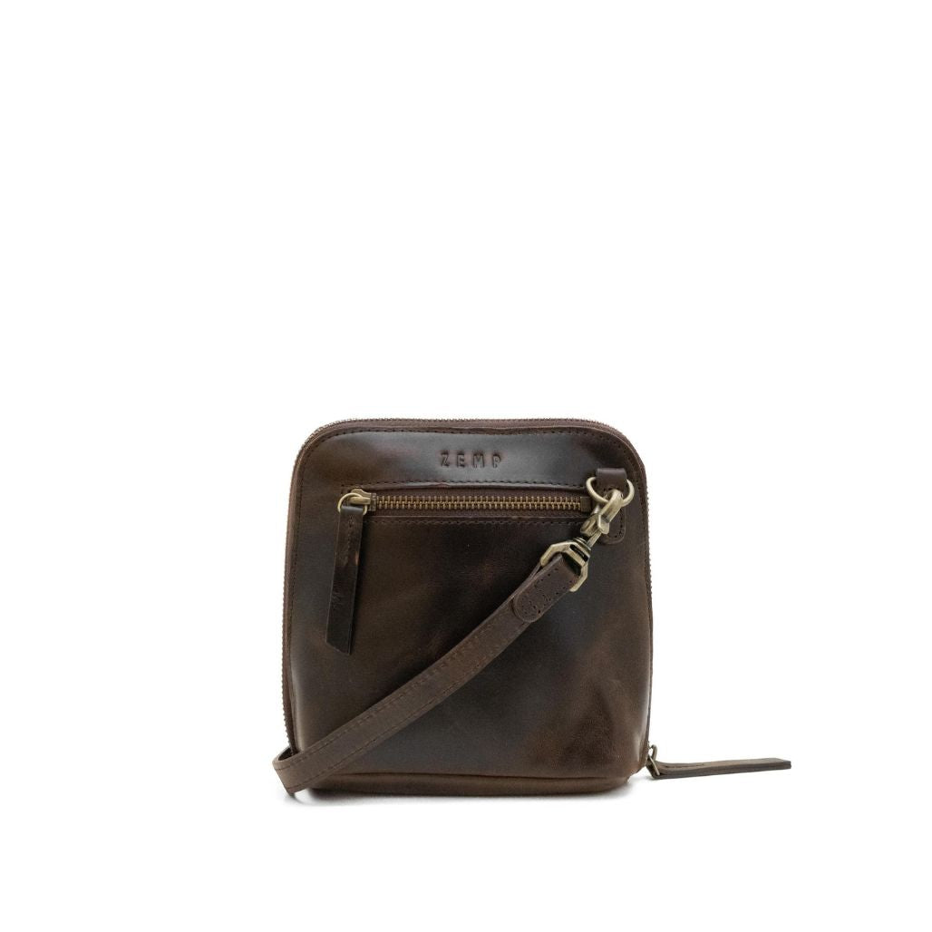 Brown leather crossbody bag with visible brand name on a white background