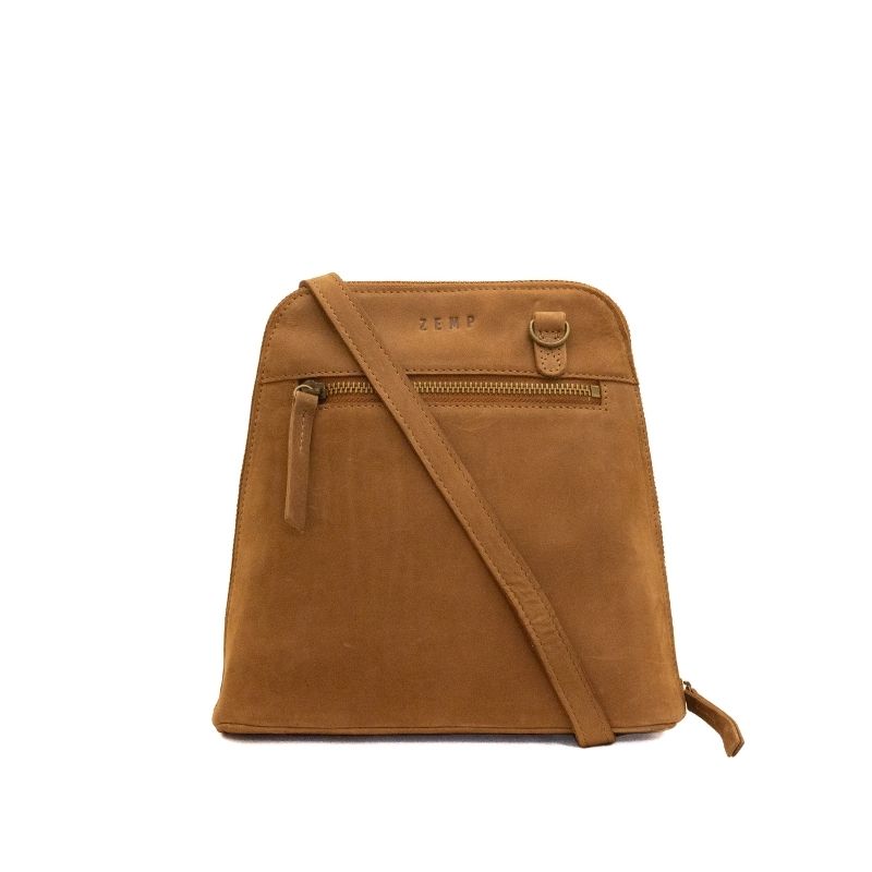 A tan leather crossbody bag with a front zippered pocket and a matching shoulder strap, shown on a plain white background.