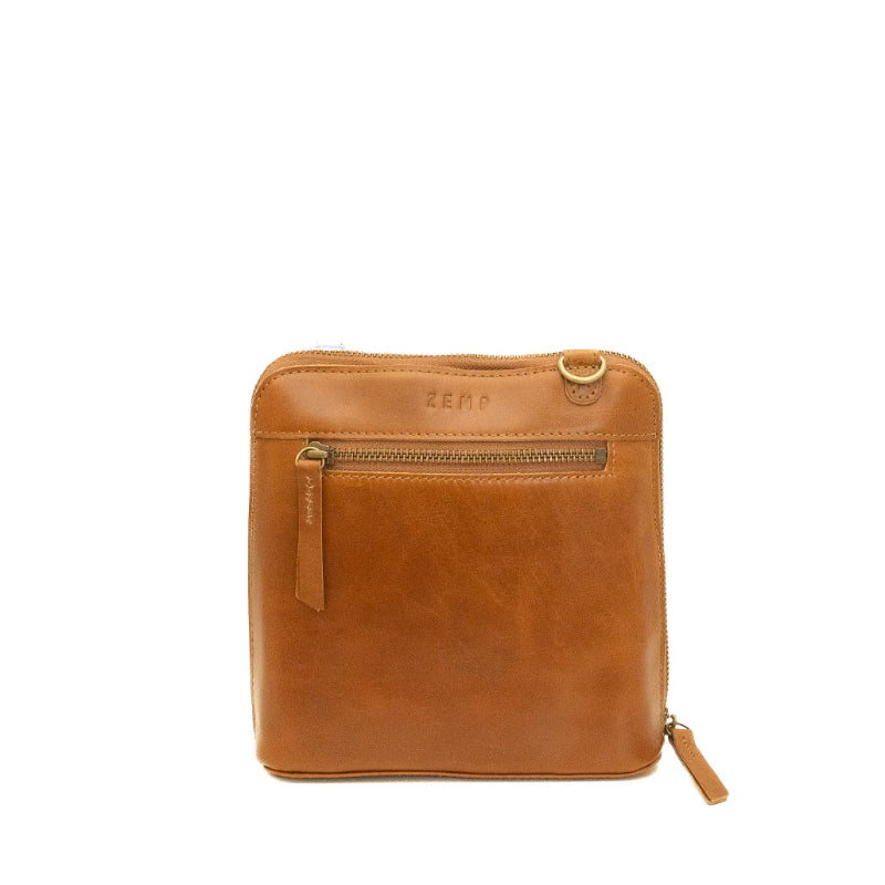 Brown leather pouch with zipper on a white background