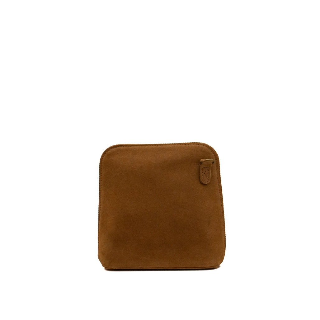 A brown suede pouch with rounded corners and a small leather tab detail on the top right, shown against a plain white background.