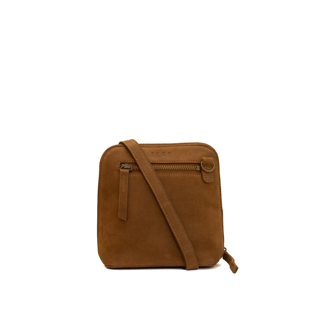 A small brown suede crossbody bag with a front zippered pocket and a matching shoulder strap, shown against a plain white background.