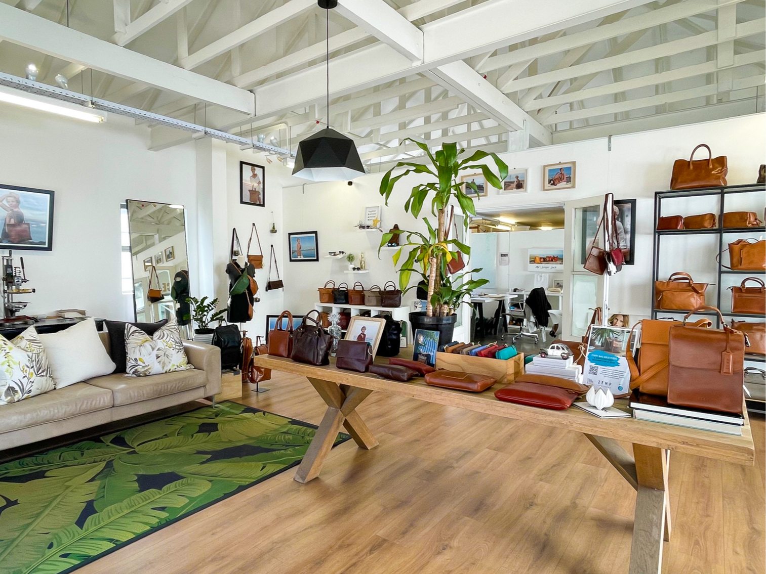 Modern living room with a couch, coffee table, and decorative items.