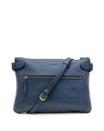 Blue leather handbag with a strap on a white background