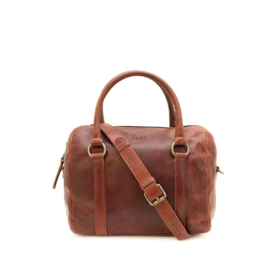 Brown leather duffel bag with a shoulder strap on a white background