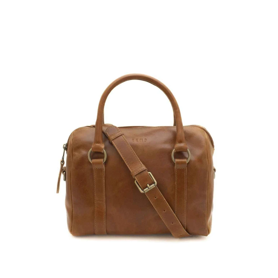 Brown leather duffel bag with a shoulder strap on a white background
