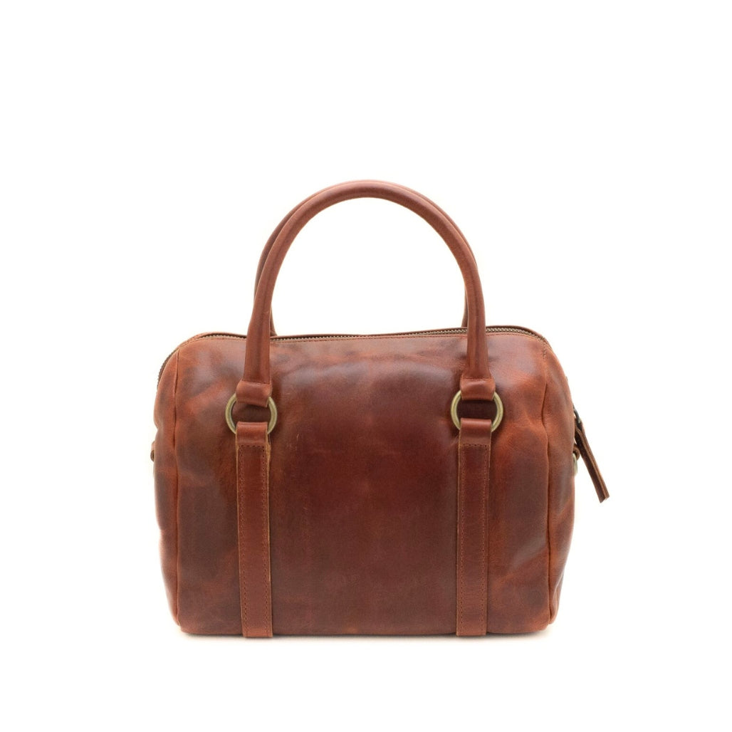 Brown leather handbag on a white background