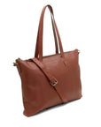 Brown leather tote bag with shoulder strap on a white background
