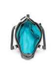 Open black handbag with teal interior on a white background
