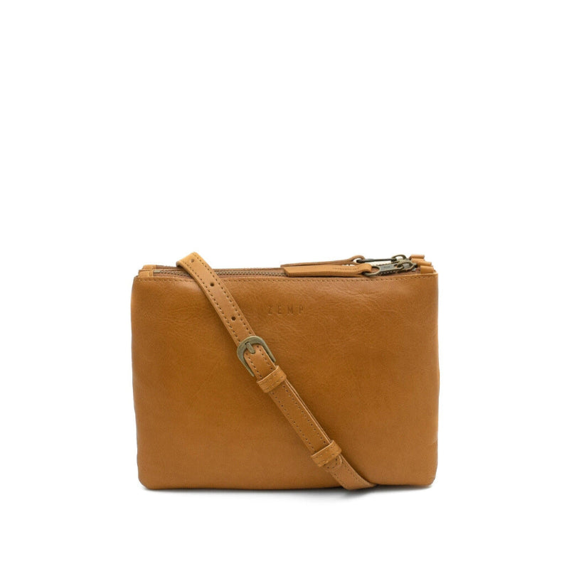 Brown leather crossbody bag on a white background