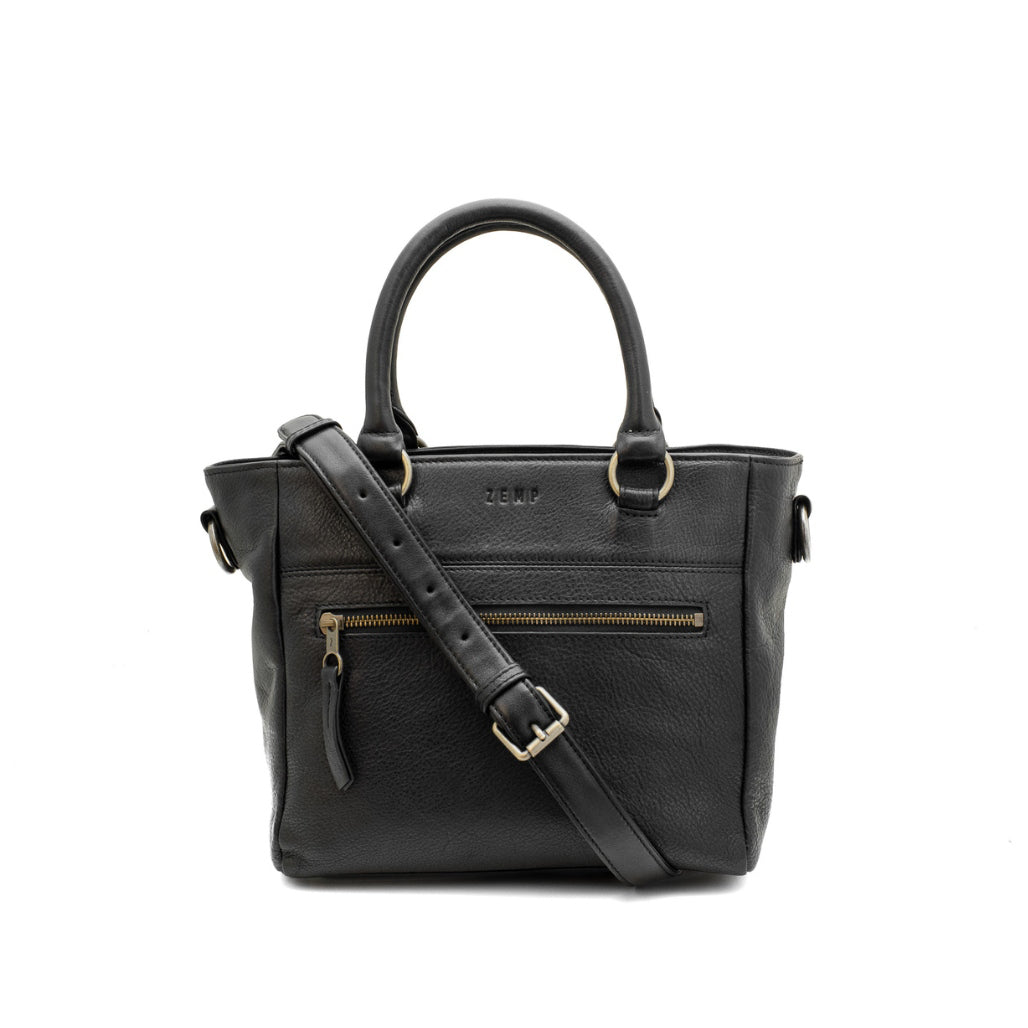 Black handbag with a shoulder strap on a white background