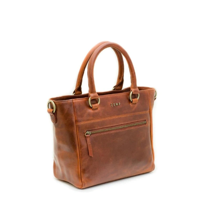 Brown leather handbag with gold accents on a white background
