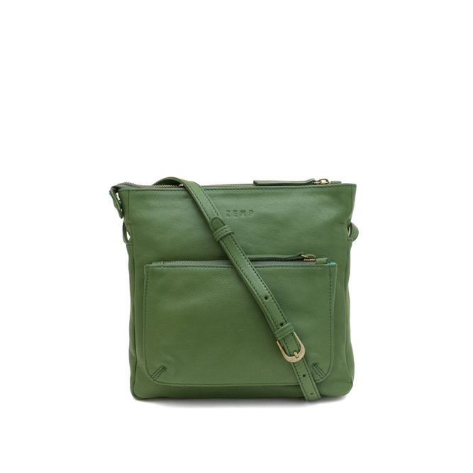 Green leather crossbody bag on a white background