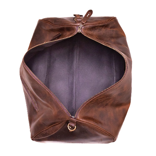 Brown leather bag with a zipper on a white background