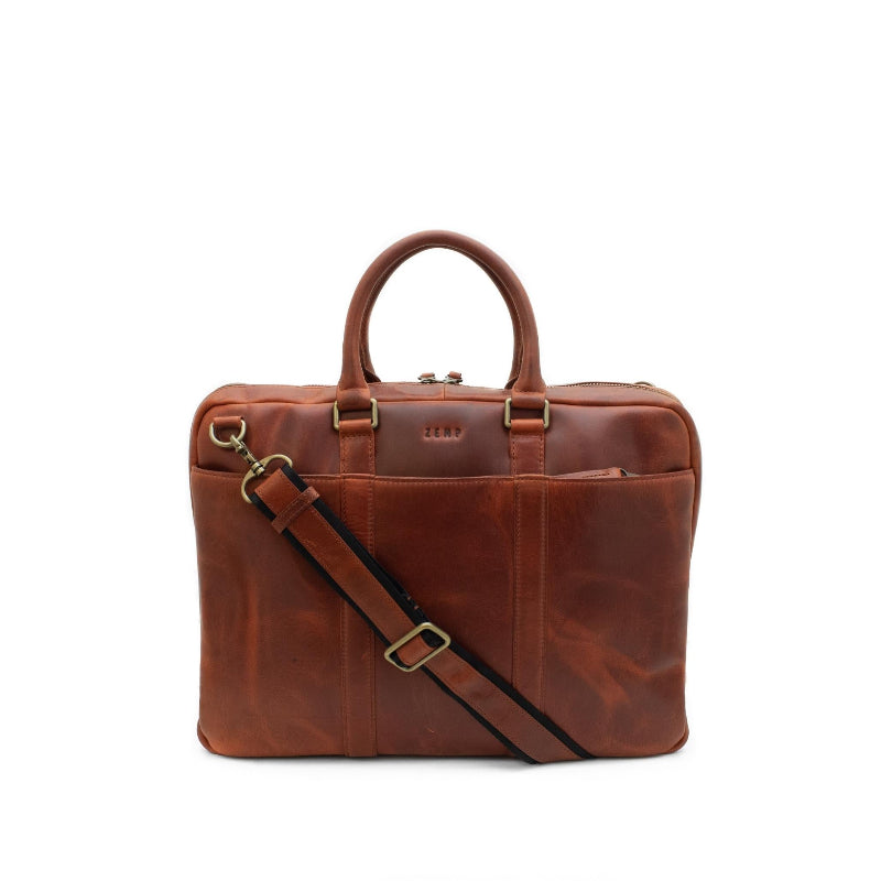 Chestnut leather briefcase with a shoulder strap on a white background