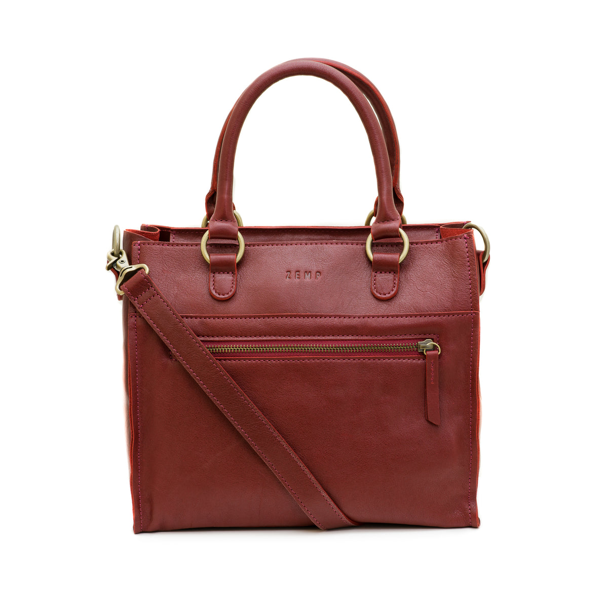 A reddish-brown leather handbag with double top handles, a detachable shoulder strap, and gold-tone hardware, shown against a plain white background.